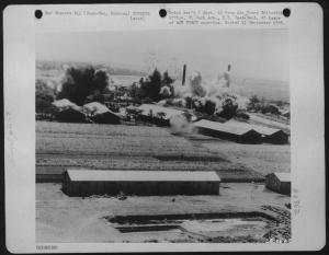 Mitchells Of 38Th Bomb Group In A May 17, 1945 Attack Drop Bombs And Propaganda Leaflets On Suan-Tau Alcohol Plant West Of Kaki. Formosa (U.S. Air Force Number 58566AC)